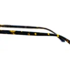 Détail branche en plastique acétate effet léopard